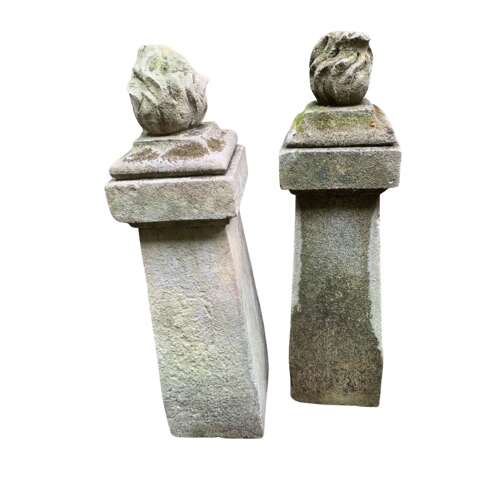 1910 pair of stone posts with flame finials