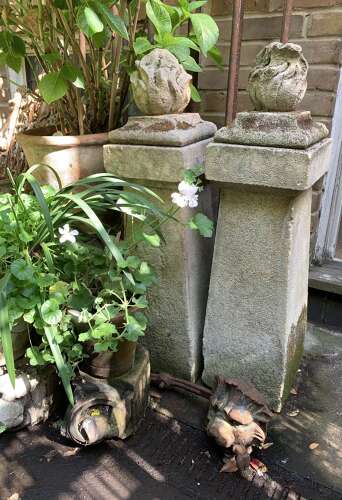 1910 pair of stone posts with flame finials