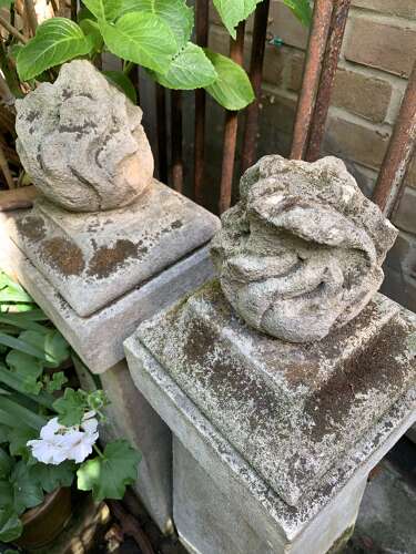1910 pair of stone posts with flame finials