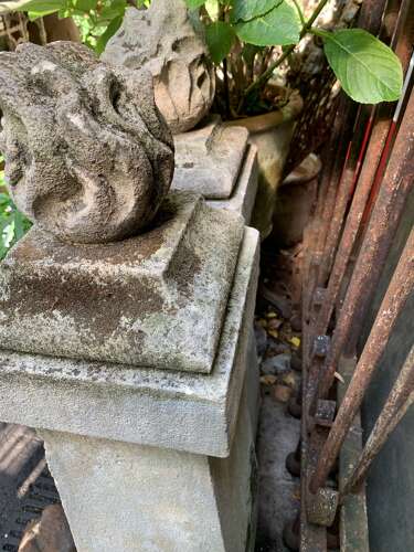 1910 pair of stone posts with flame finials