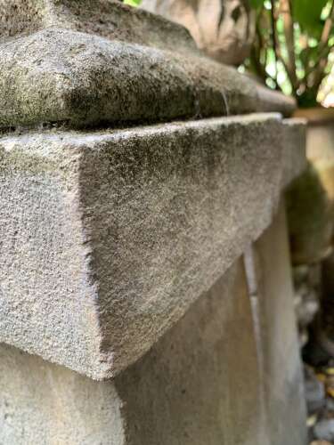 1910 pair of stone posts with flame finials